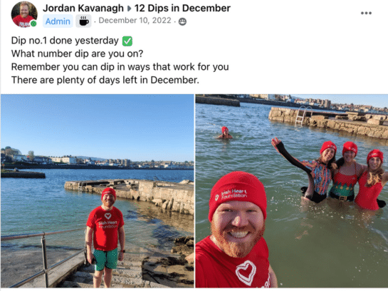Screenshot of a Facebook group post from Jordan Kavanagh to 12 Dips in December group. The text reads 'Dip no. 1 done yesterday. What number dip are you on? Remember you can dip in ways that work for you. There are plenty of days left in December'. Two photos accompany the text: one is of Jordan standing at the water's edge on steps leading down into the water. He is smiling at the camera and wearing a red Irish Heart Foundation t-shirt and beanie hat. The second photo is taken selfie-style by Jordan, wearing a red Irish Heart Foundation t-shirt and beanie hat. He is in the water and behind him are three people also in the water. They have their arms around each other and are waving at the camera. They too wear the red beanie hats.