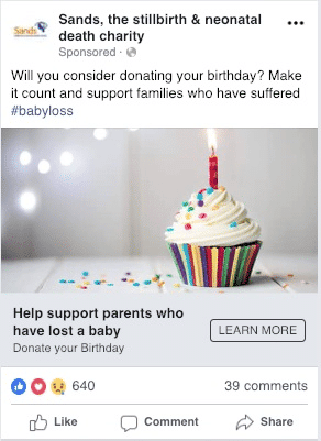 Screenshot of a Facebook advert for Sands charity. The image show a photo of a cupcake with a lit candle and sprinkles.
