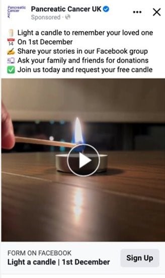 Screenshot of a Pancreatic Cancer UK's Facebook ad for their In-Memory campaign. The image shows the start of a video of someone holding a lit match to a candle. The text above reads 'Light a candle to remember your loved one on 1st December. Share your stories in our Facebook Group. Ask your family and friends for donations. Join us today and request your free candle'