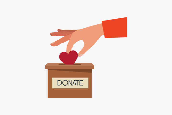Illustration of a hand placing a heart into a wooden "DONATE" collection box
