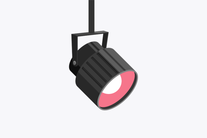 Illustration of a black spotlight fixture with a pink beam